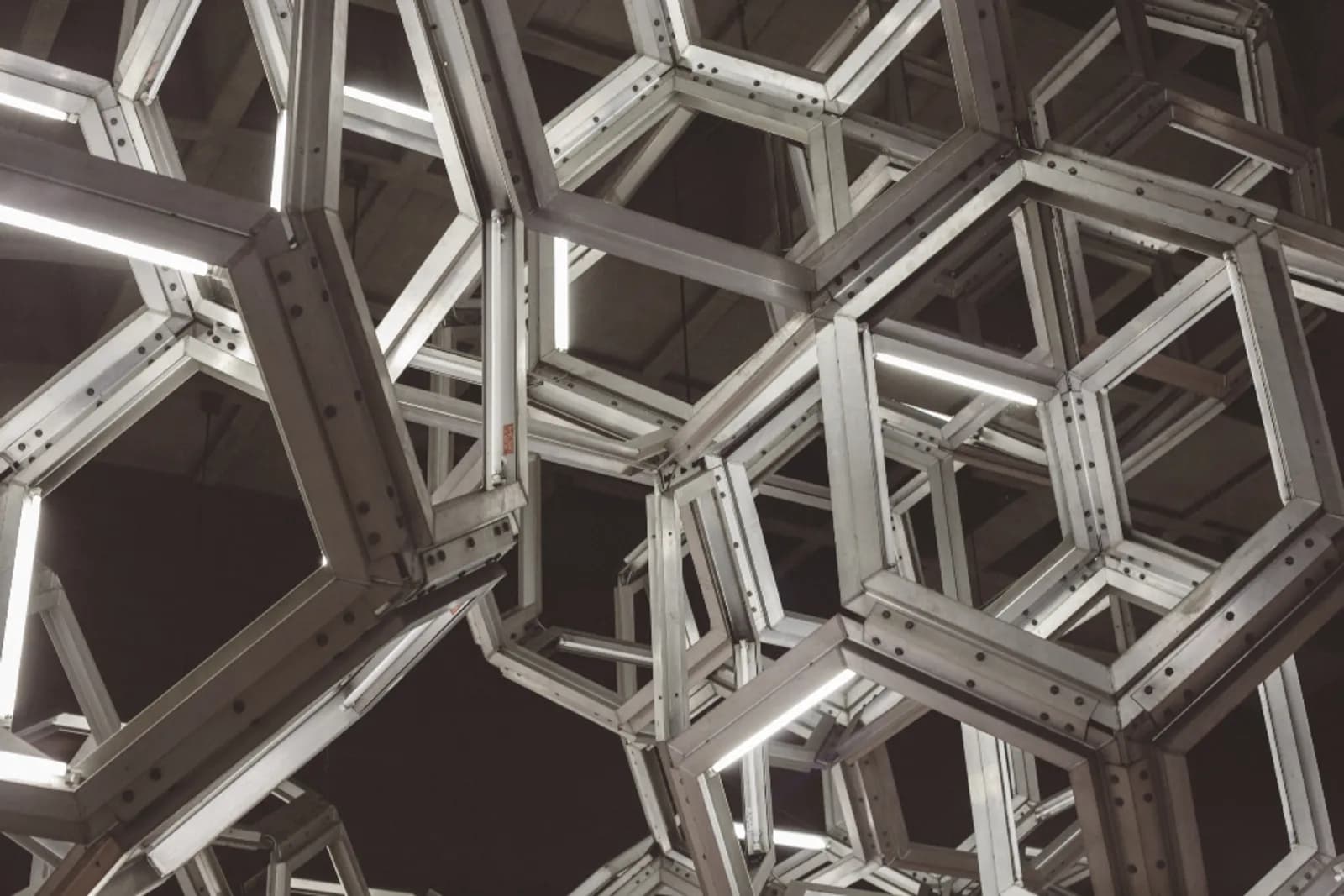 A modular steel lattice, the same unit repeated and bolted into one structure